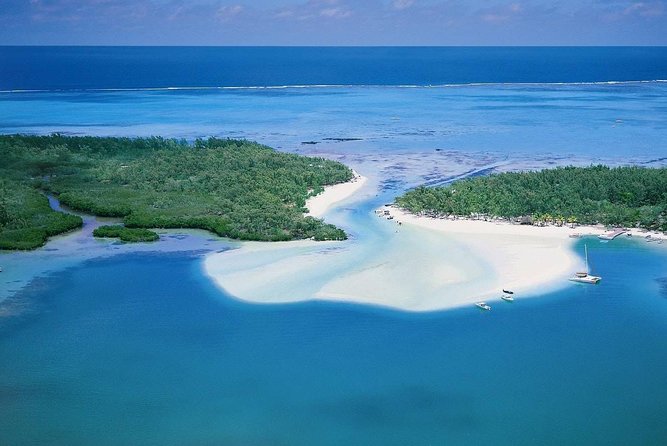 Full-Day At Ile Aux Cerf: Speed Boat, GRSE, Lunch On A Private Island & Transfer - Ile aux Cerf beach time: chairs, swimming, snorkeling, and choosing your pace