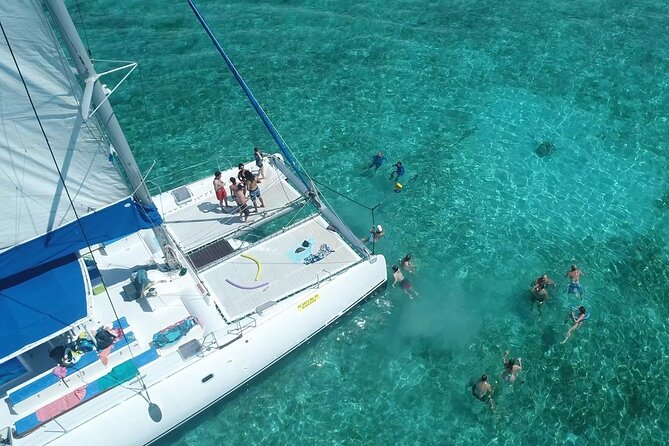 Full Day Catamaran Cruise on shared basis to Bénitiers Island - Crystal Rock lunch and the barbecue moment you’ll actually remember