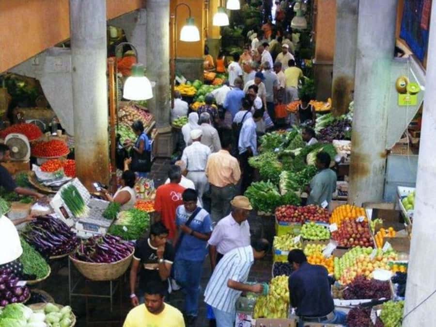 Port Louis: Private Guided Sightseeing Tour - Caudan Waterfront, modern storefronts plus an open craft bazaar