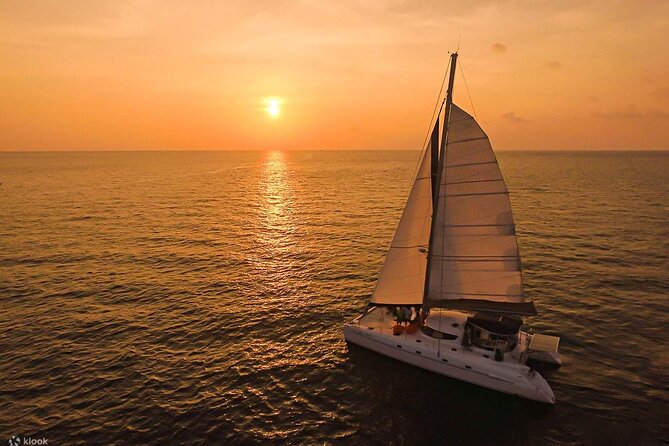 Private Exclusive Sundowner catamaran with Dinner & Transfer - The Ile aux Aigrettes anchoring moment, plus snorkeling if the sea cooperates