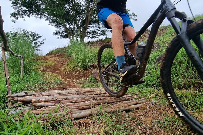 Private Mountain Biking Experience in the Wild South of Mauritius - Views on the way up and down: lagoon, mountains, and a waterfall moment